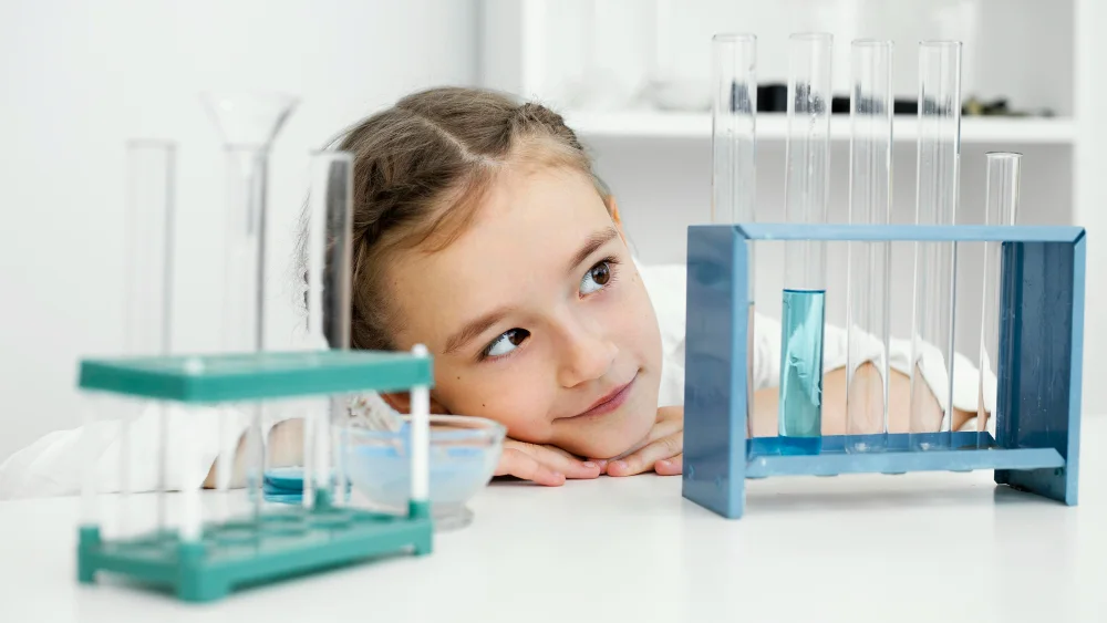 front view young girl scientist with test tubes lab copy